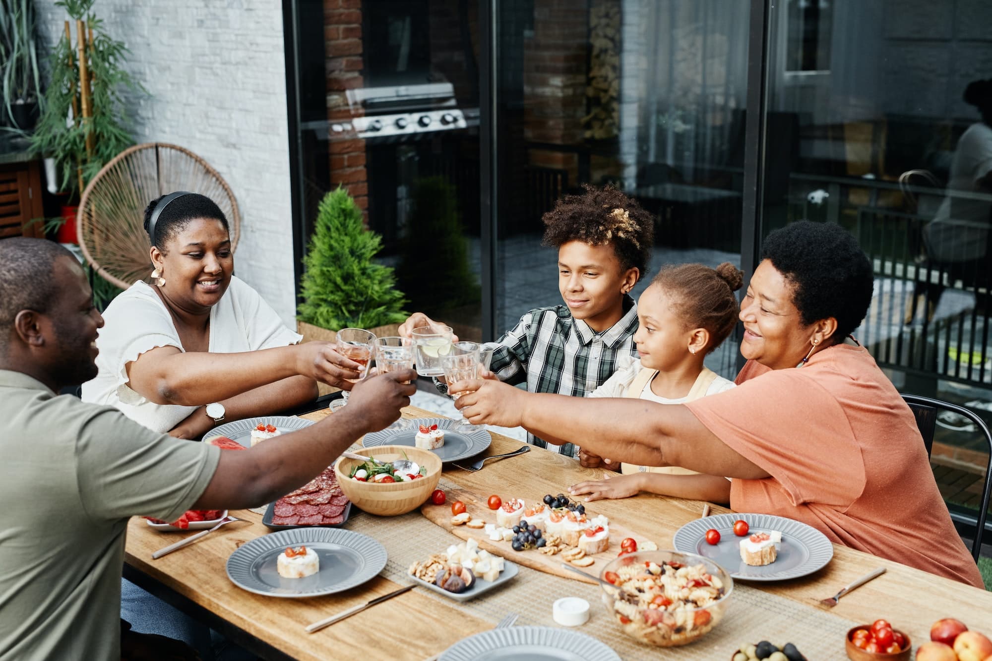 Happy Family Toasting Outdoors