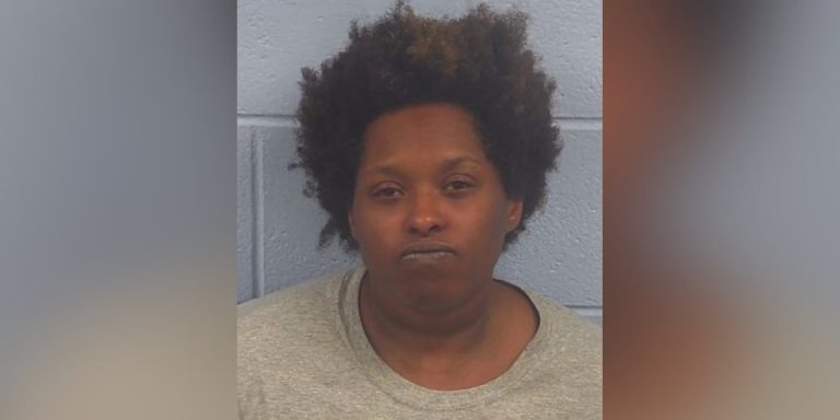 Woman arrested after dead baby girl found inside hearse at funeral home, police say